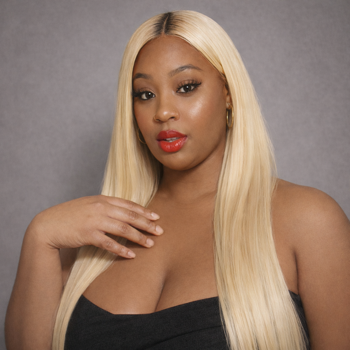 Raw 613 Blonde Straight hair bundle Woman with long blonde wig against a gray background